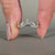 Round diamond wedding band with a prong set design.
