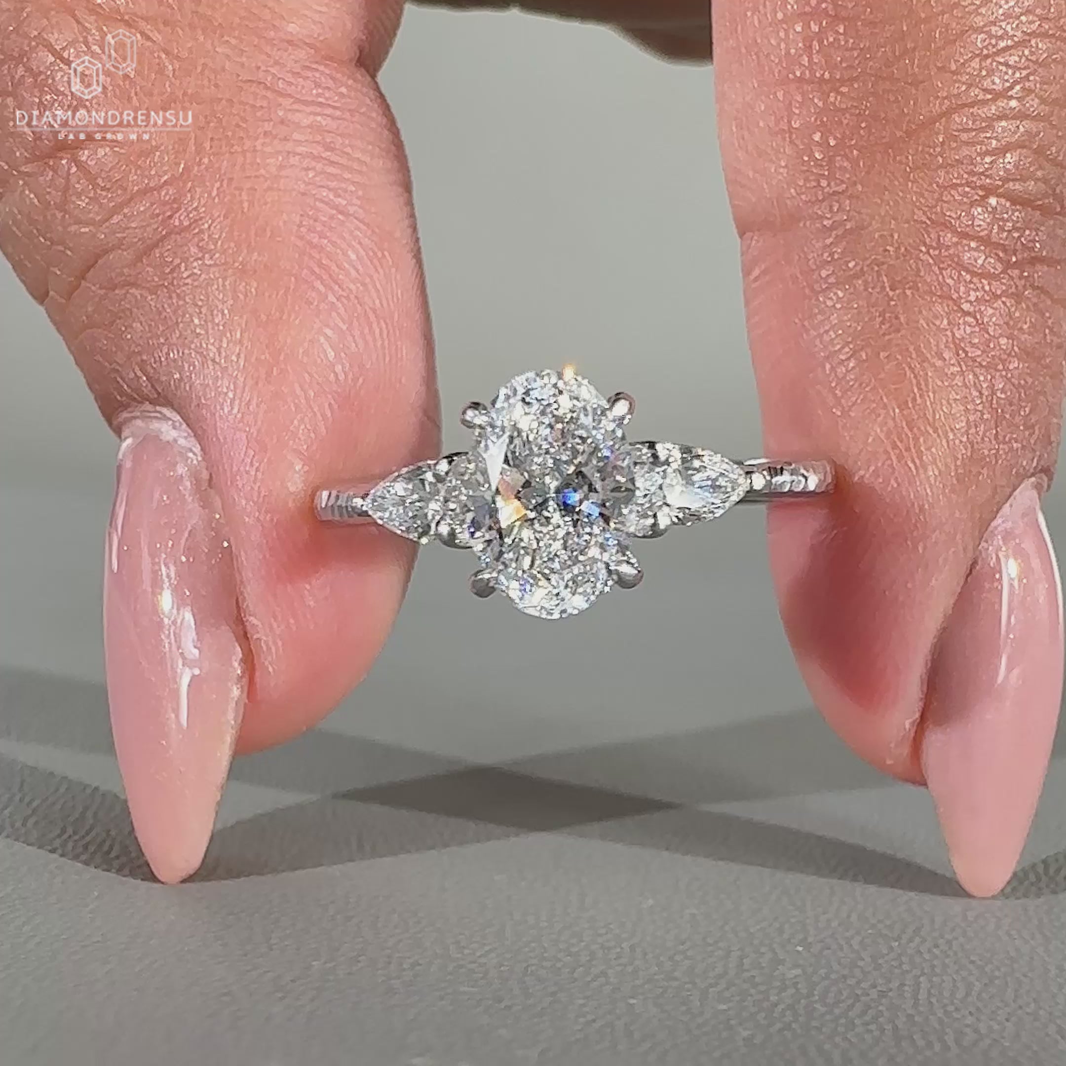 Oval cut diamond ring in white gold ring design.
