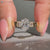Oval diamond ring with five stone style.