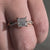 Handmade ring with a claw prong setting and a stunning princess cut engagement ring design.
