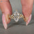 Nature inspired marquise ring with filigree details.