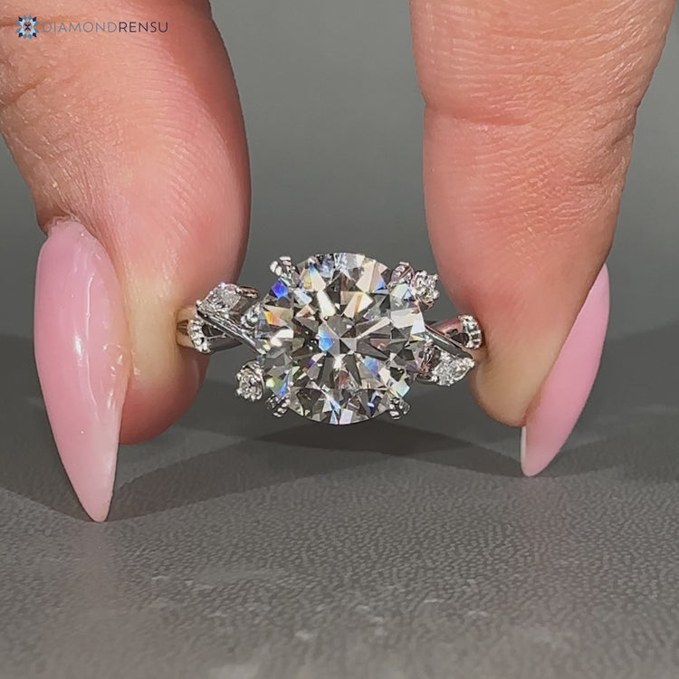 Nature inspired ring with four leaf style prong setting.