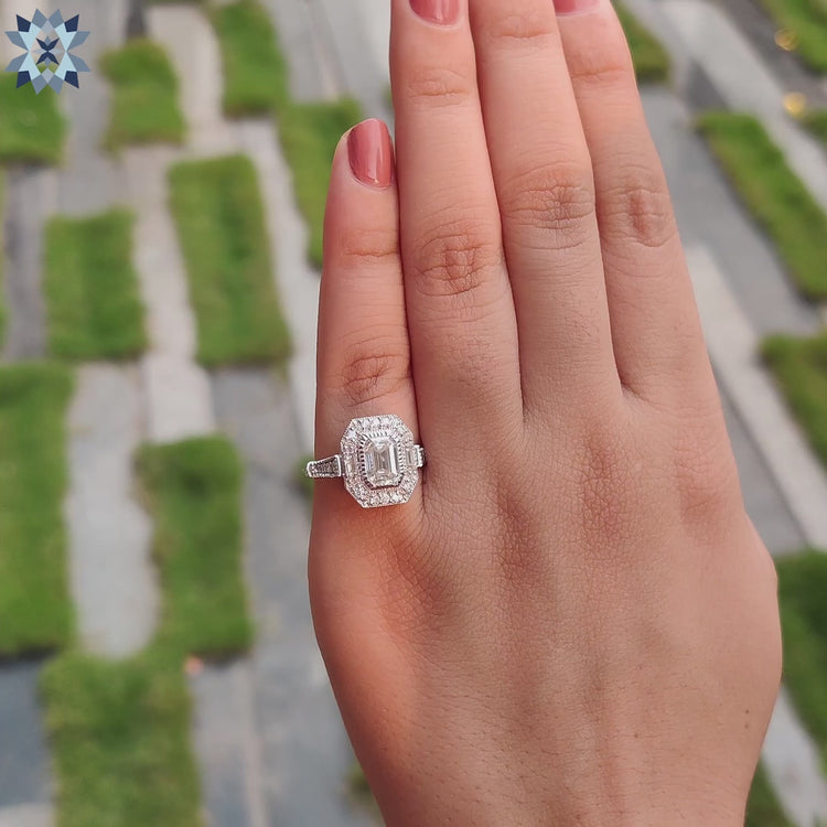 Buy engagement ring featuring a vintage emerald ring with a white gold engagement ring setting.