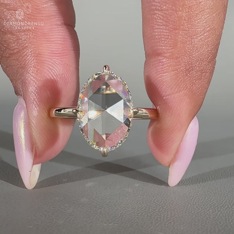 Handmade oval rose cut ring with open gallery setting.