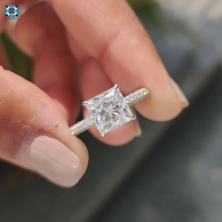 Hidden halo ring featuring princess cut moissanite and 4 prong claw setting.
