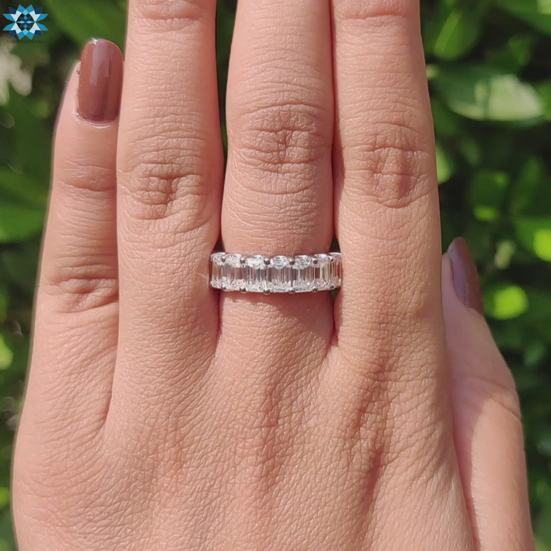 Elegant emerald cut eternity band featuring a prong setting for maximum brilliance.