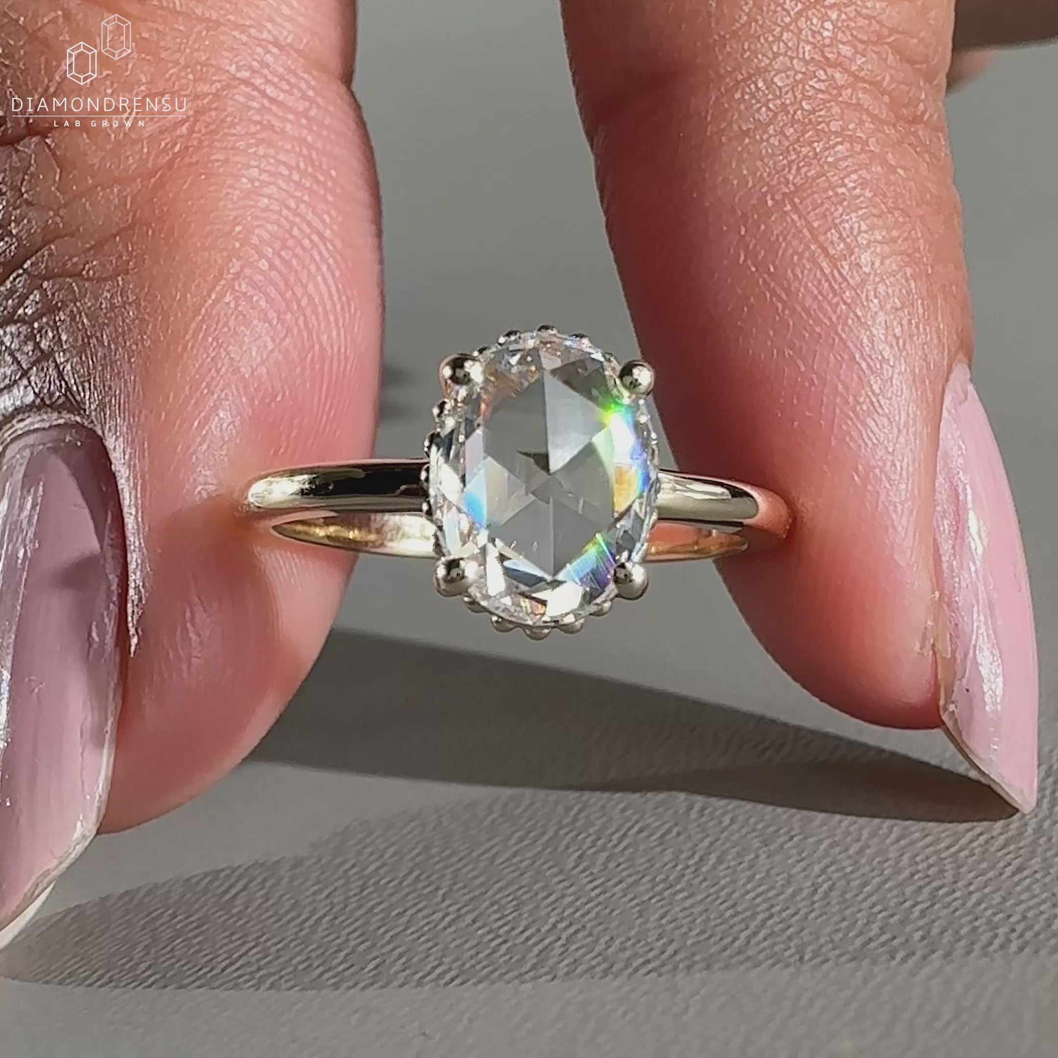 Oval cut diamond ring featuring milgrain setting ring
