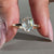 Oval cut diamond ring featuring milgrain setting ring
