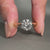 Round cut engagement ring in white and yellow gold design.
