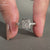 Round diamond pave band in white gold for UK engagement ring buyers.
