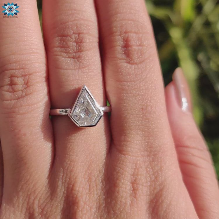 Custom handmade engagement ring with shield cut moissanite.
