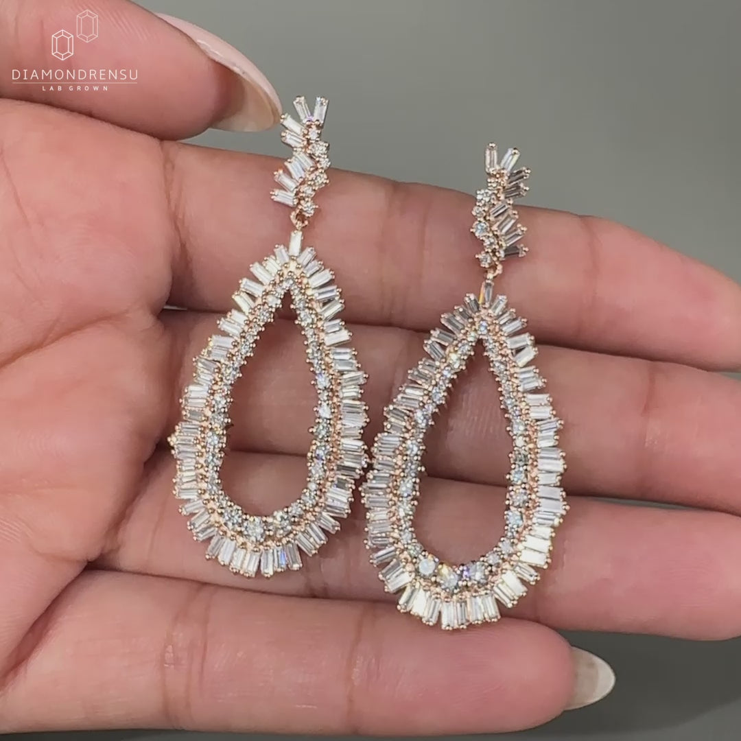 Baguette and round diamond earrings in cluster style.
