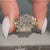 Nature inspired radiant diamond ring with twisted shank.