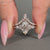 Marquise wedding ring with muse setting and curvy band.