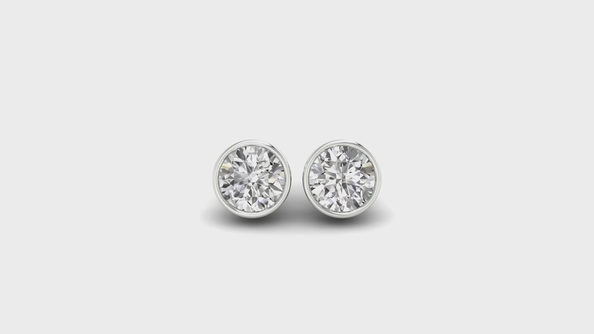 1.97 TCW Round Cut Colorless Moissanite Bezel Set Moissanite Stud Earrings