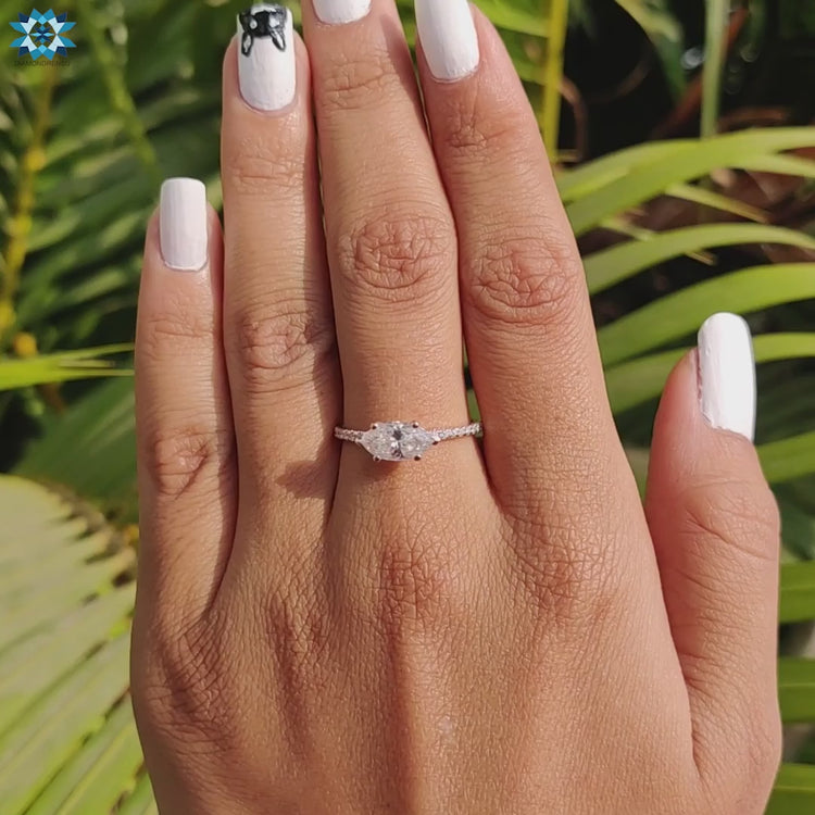 Marquise cut stone set sideways on rose gold band.
