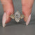 Handmade marquise diamond ring with round side stones.