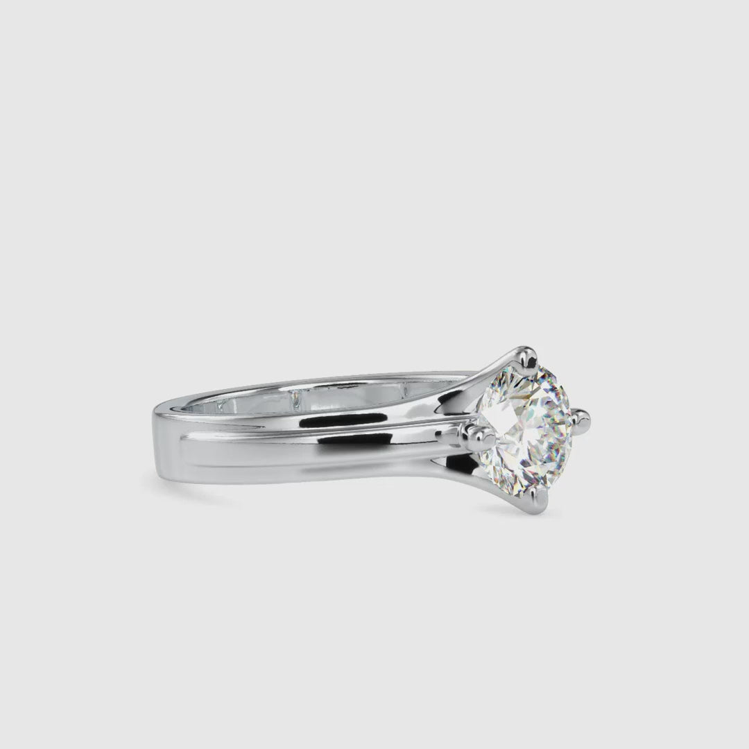 Compass setting ring with a stunning round solitaire diamond.
