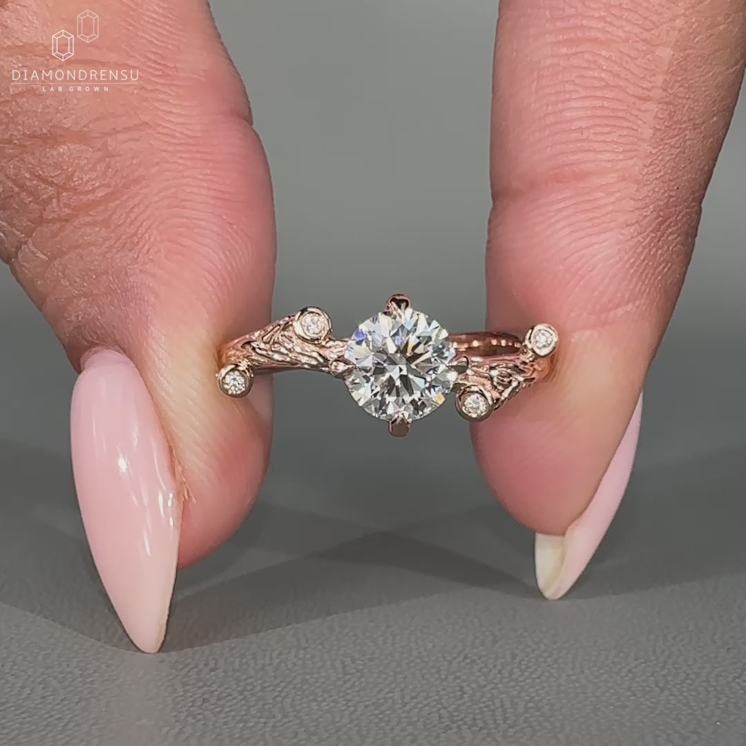 Nature inspired ring with round side stones setting
