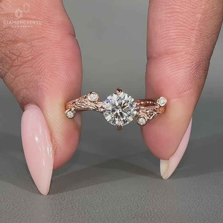Nature inspired ring with round side stones setting
