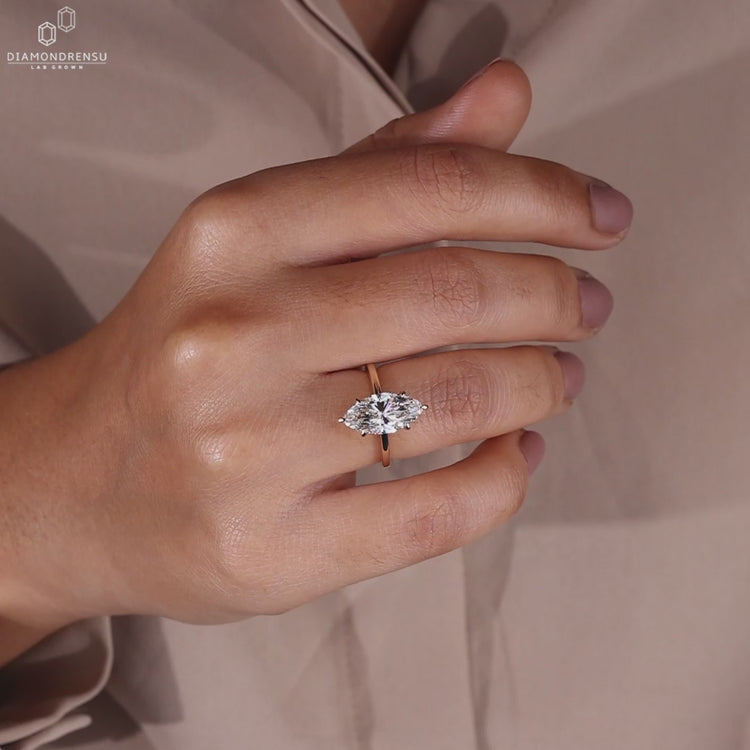 Custom engagement ring with marquise center.
