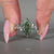 Handmade marquise ring with moss agate side stones.