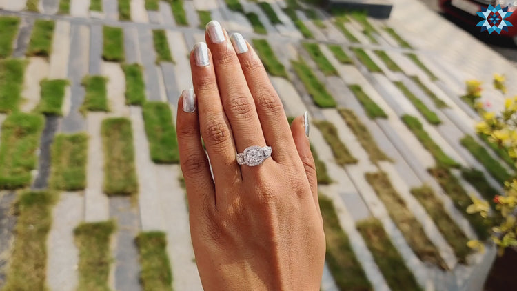 Handmade ring with three moissanite stones and pave accents.
