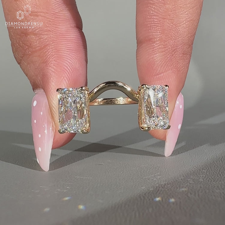 Radiant diamond two stone ring with curvy stackable design.