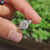 Round centre stone ring crafted in white gold with claw prong setting.
