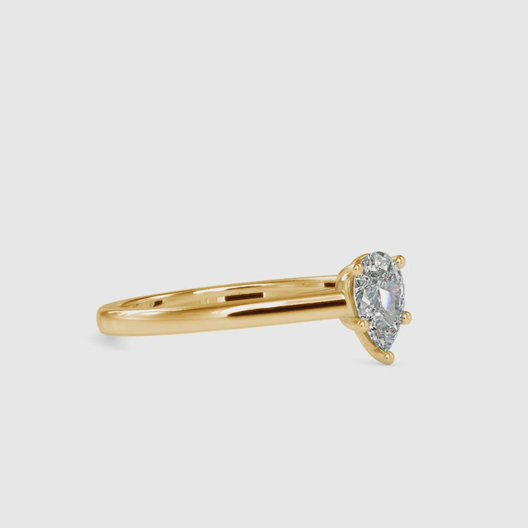 Simple teardrop solitaire diamond ring in UK style.