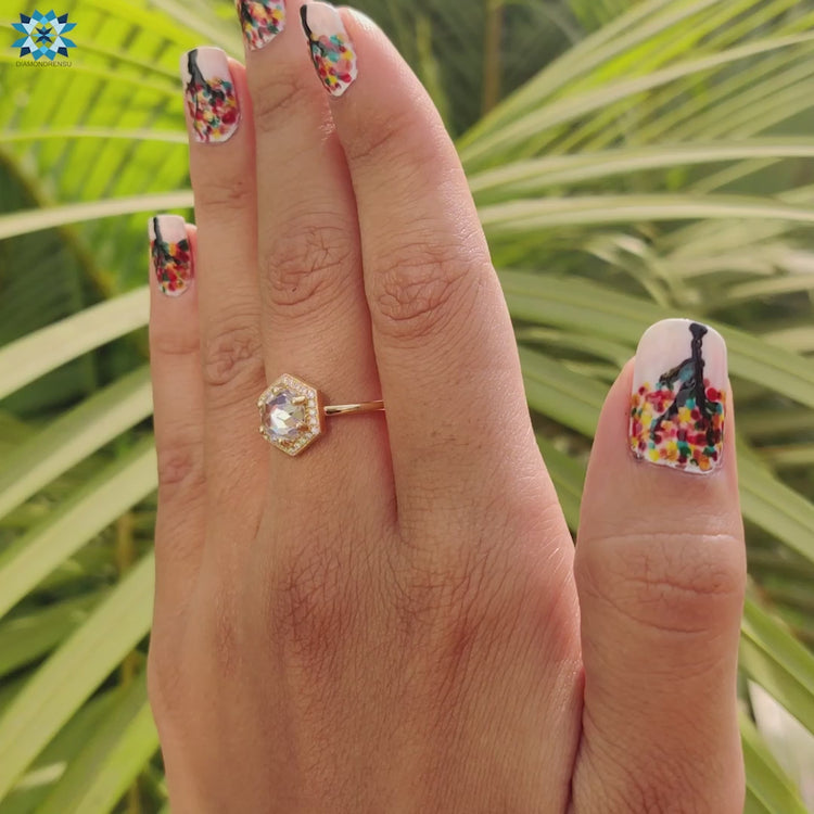 Halo ring featuring rose cut moissanite.
