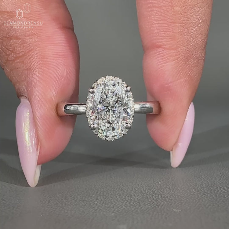 Lab grown oval diamond ring with double side pave band
