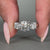 Round diamond engagement ring featuring prong setting and custom design.
