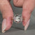 Solitaire engagement ring featuring a rose cut center.
