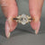 This ring features a round diamond engagement ring style.
