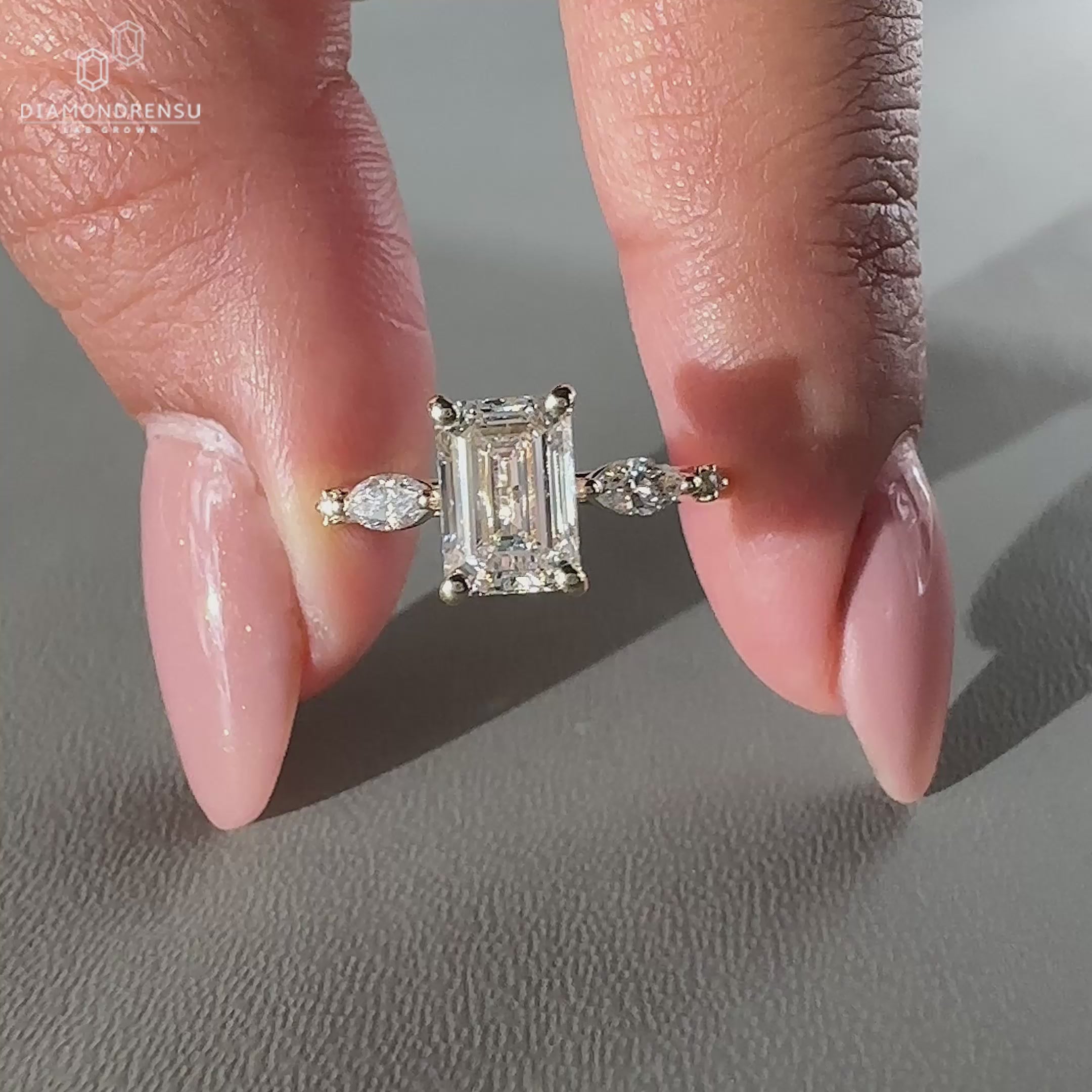 Five diamond engagement ring featuring 2 marquise and 2 round side stones.
