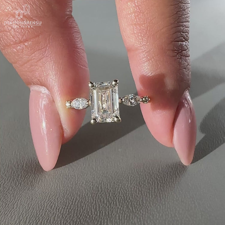 Five diamond engagement ring featuring 2 marquise and 2 round side stones.
