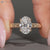 Vintage oval diamond ring with milgrain details.