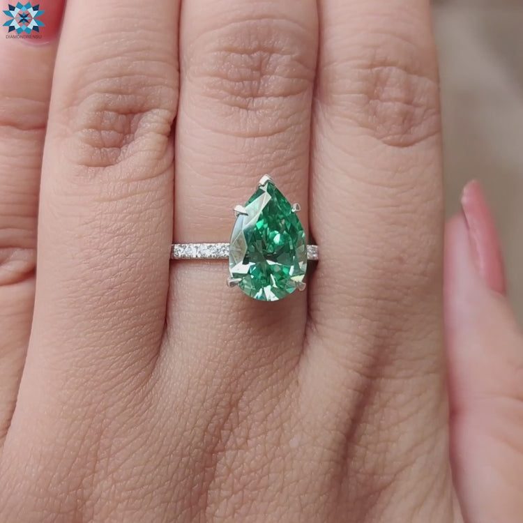 Pear cut moissanite ring with 4 claw setting.
