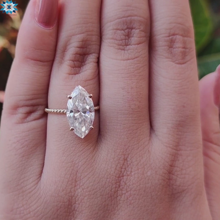 Yellow gold twisted shank ring with hidden halo.
