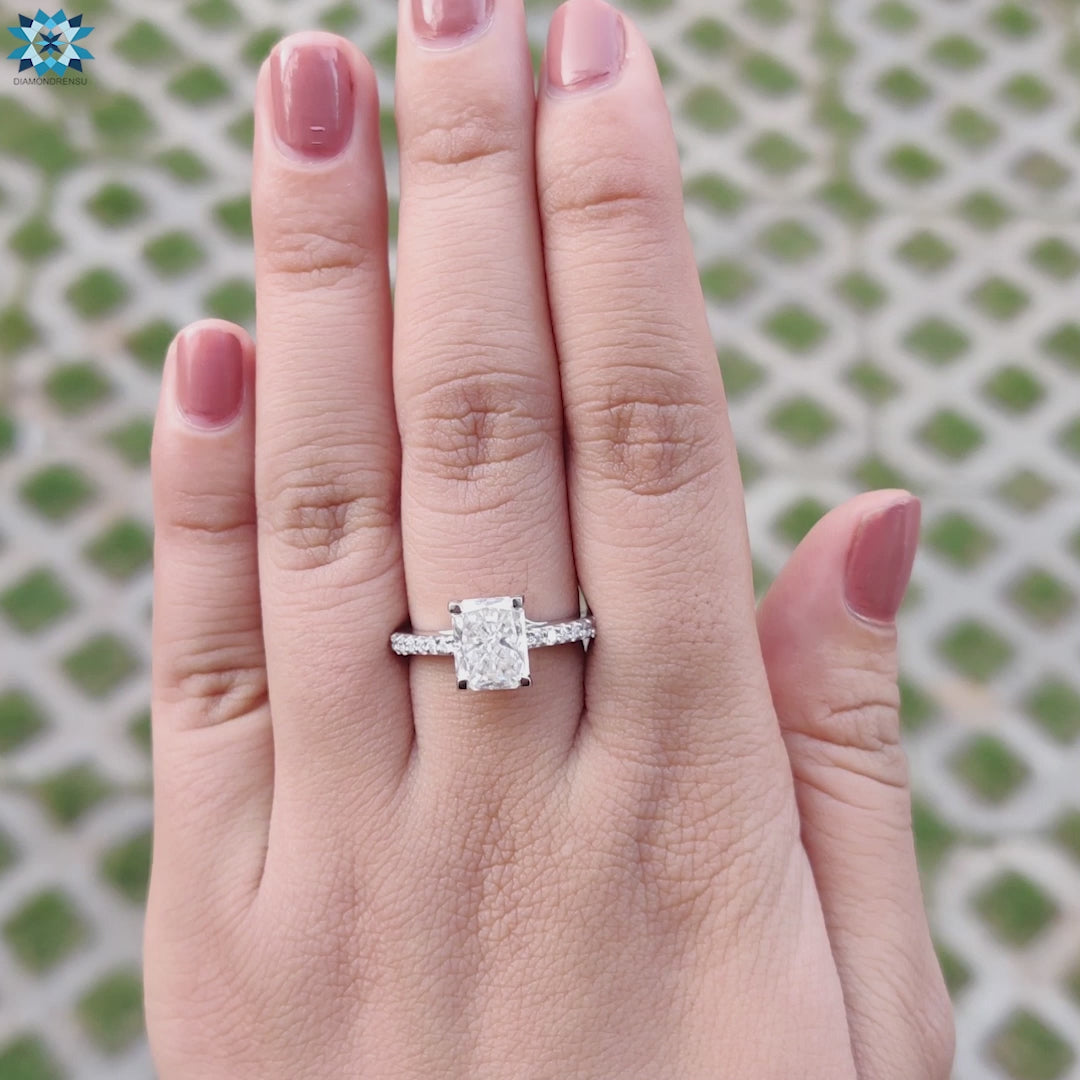 Unique UK engagement ring with a radiant cut design and stunning moissanite centre.