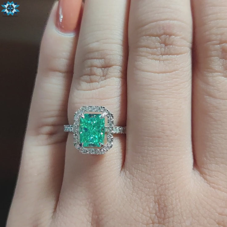 Handmade moissanite ring in white gold halo style.
