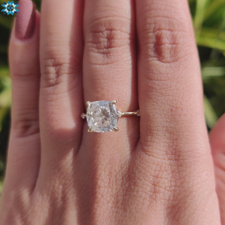 Yellow gold ring with distance pave and claw prong setting.
