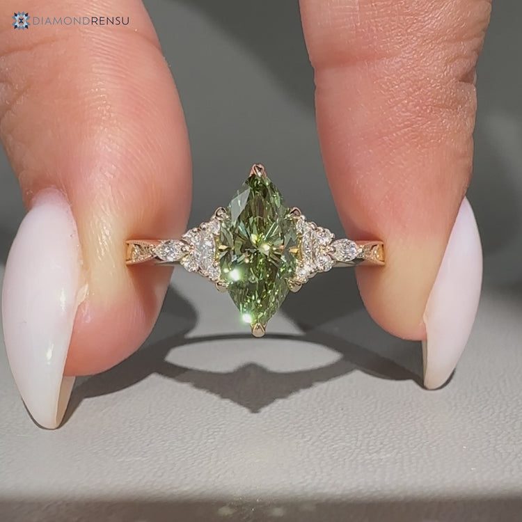 Marquise engagement ring with round and marquise side stones.