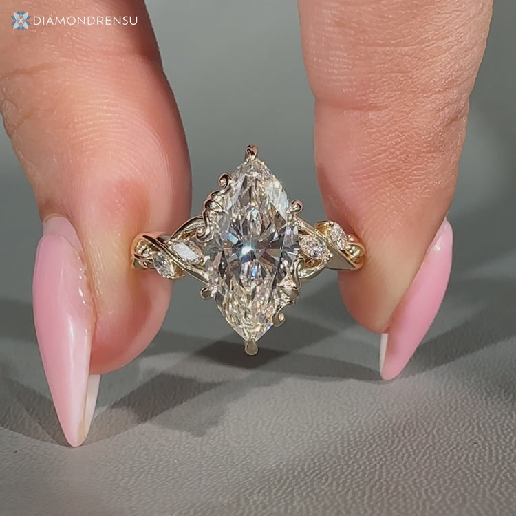 Marquise engagement ring with marquise side stones.