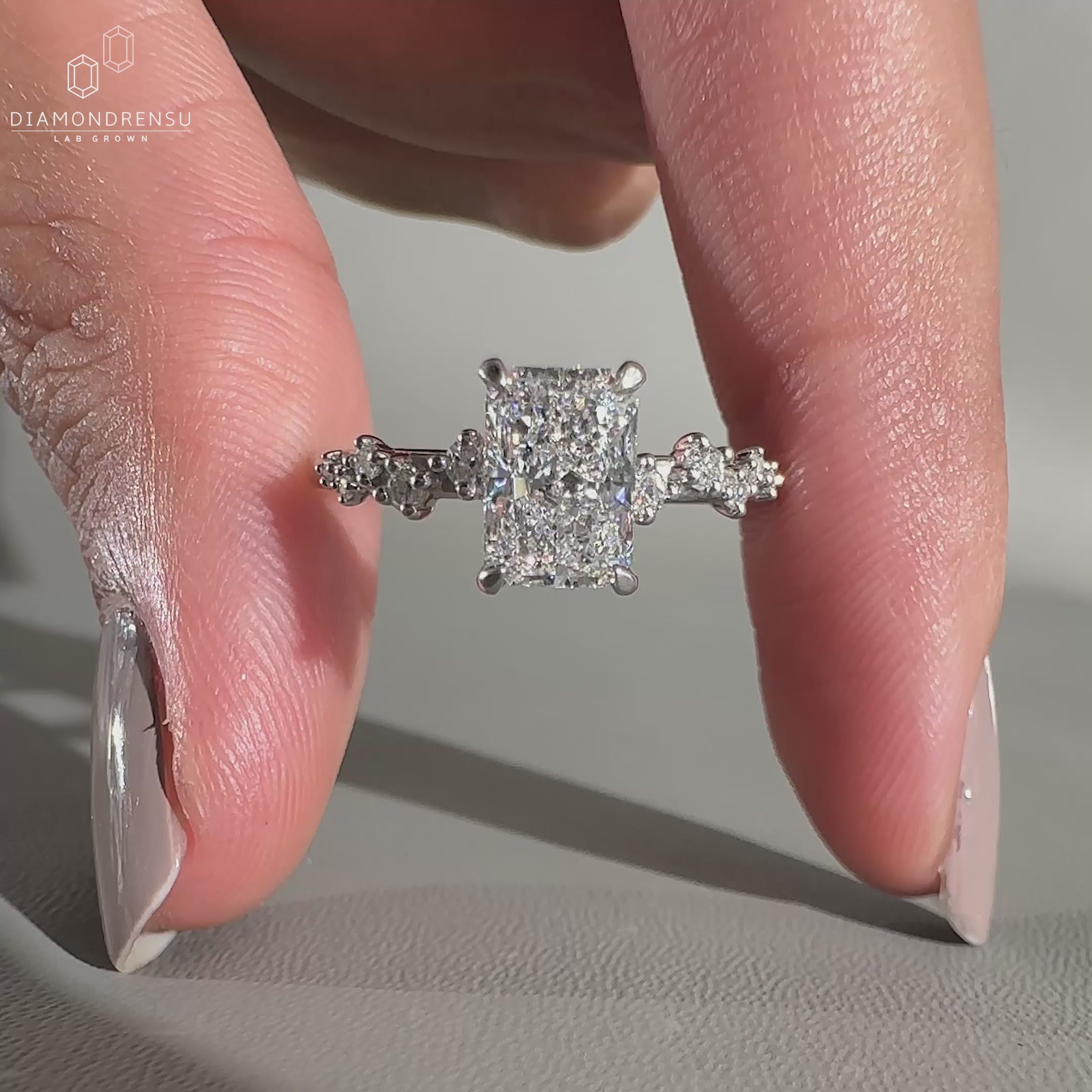Round cut hidden halo engagement ring in white gold.
