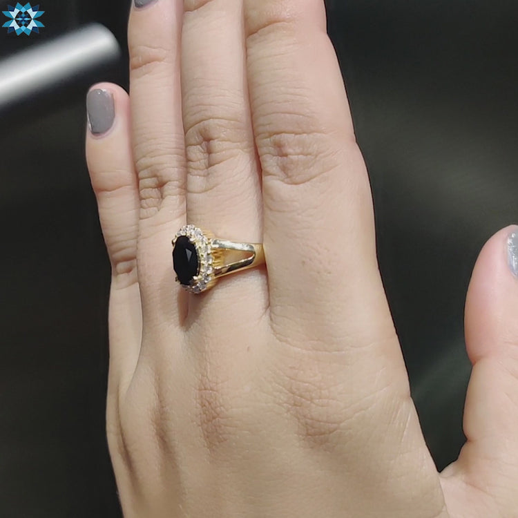 Halo engagement ring with black moissanite center.
