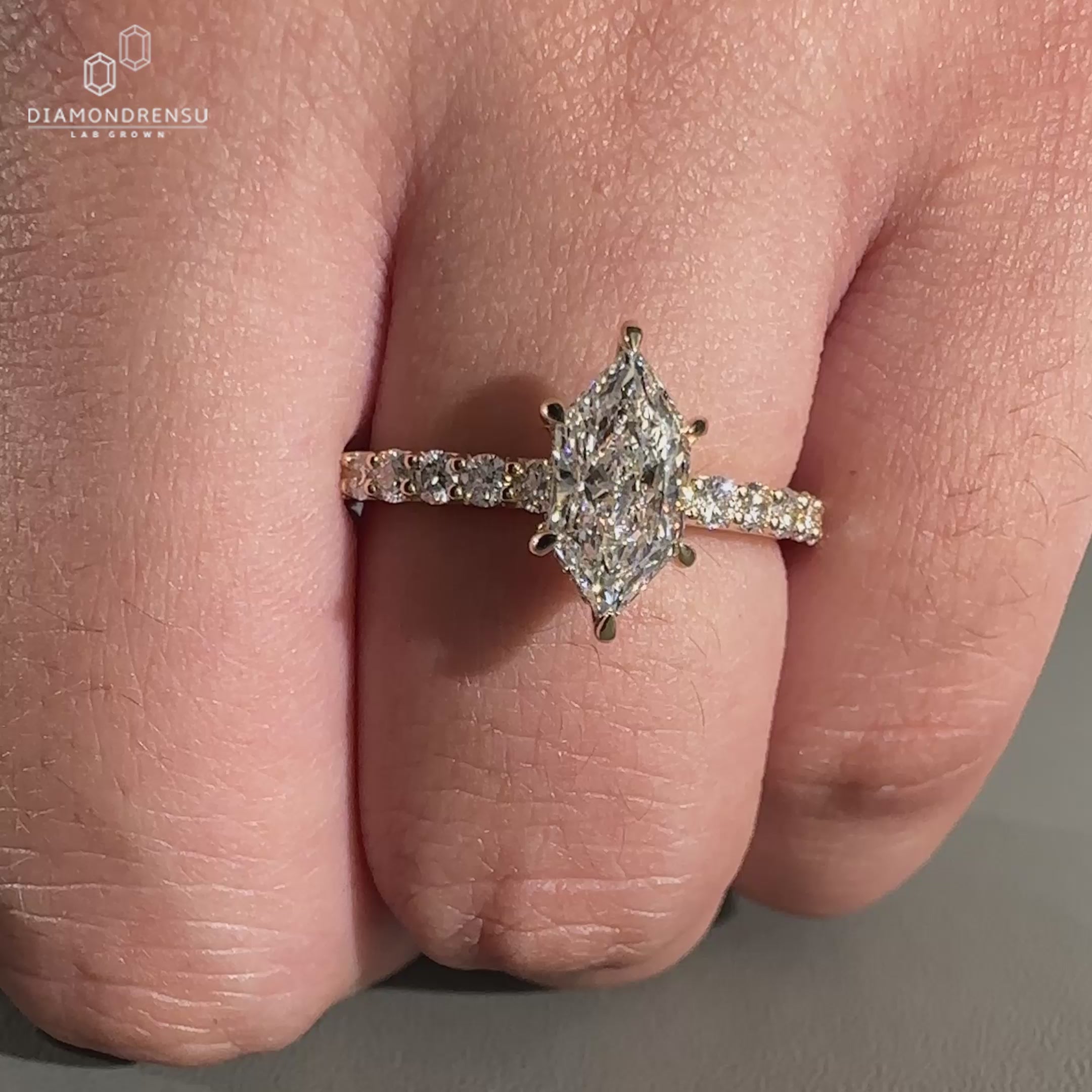 Dutch Marquise Ring crafted in hidden halo engagement ring style.
