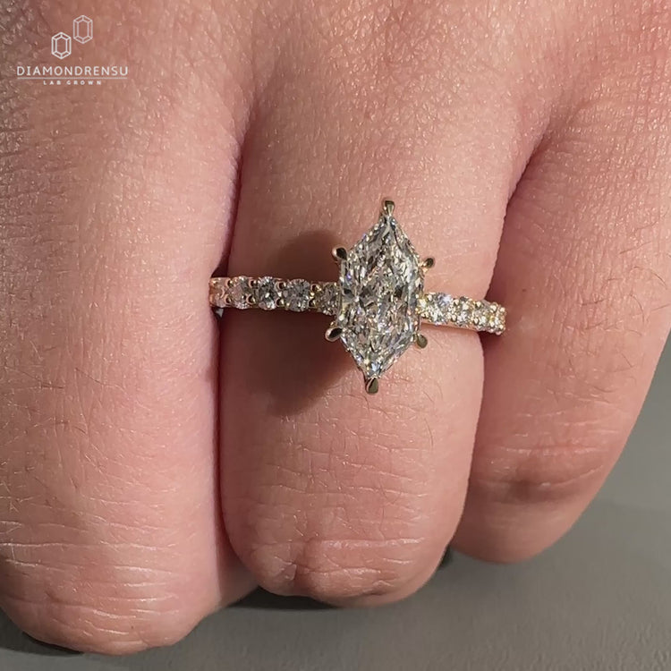 Dutch Marquise Ring crafted in hidden halo engagement ring style.
