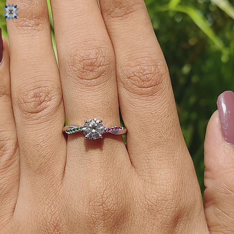 Handmade moissanite ring with twisted band and colorful sides.
